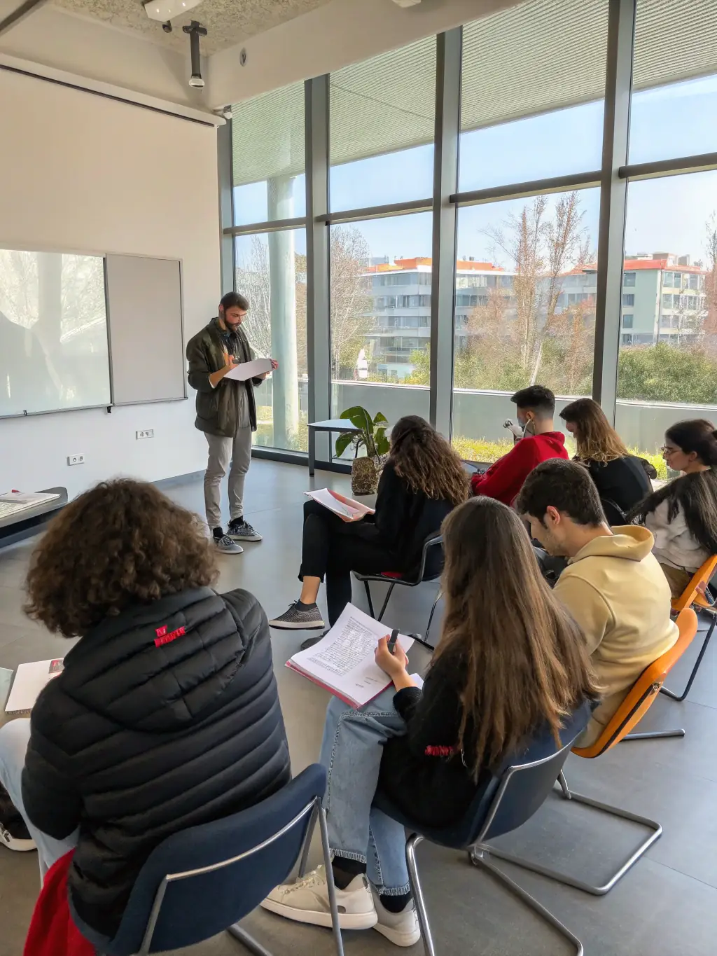 A picture of a classroom setting where students are learning about the importance of audiovisual preservation and restoration techniques, emphasizing education.